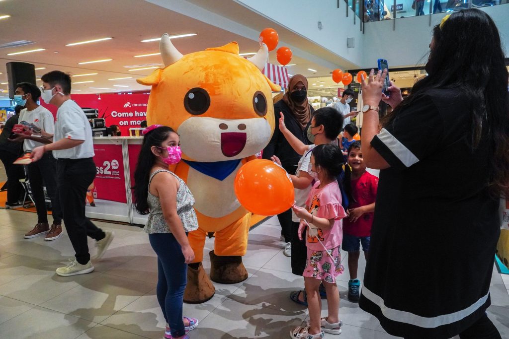 moomoo mascot interacting with families and children, increasing the event engagement and interactivity