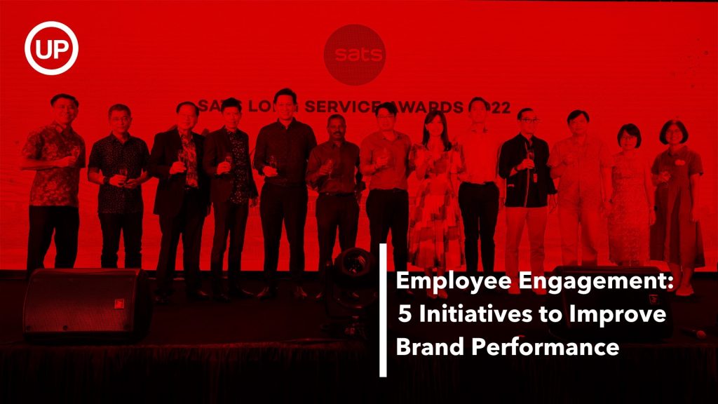 Employee engagement: SATS long service award stage prize giving with a red filter above photograph
